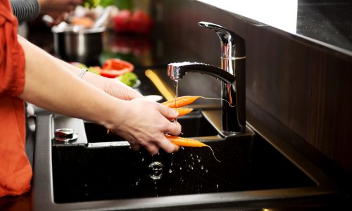 What are the causes of low water pressure in kitchen sink?